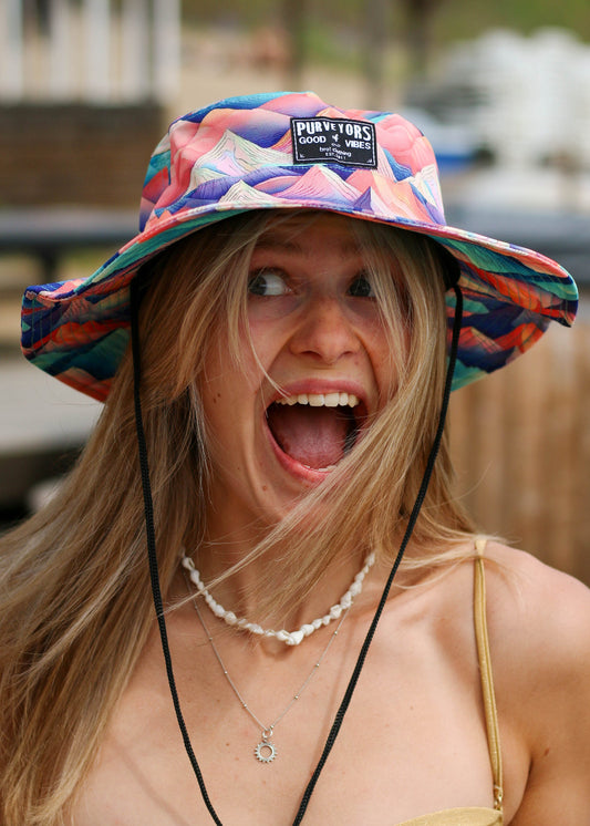 Woman wearing a colorful boonie hat with a blurred background